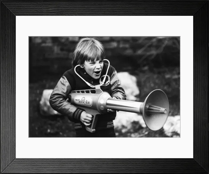 Framed Print : Seven year old Matthew Allen tries out his new sonic laser gun. 29th January 1979 Framed Print : Seven year old Matthew Allen tries out his new sonic laser gun. 29th January 1979