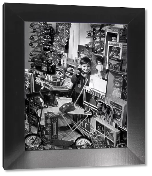 Young boy surrounded by toys. 23rd November 1970