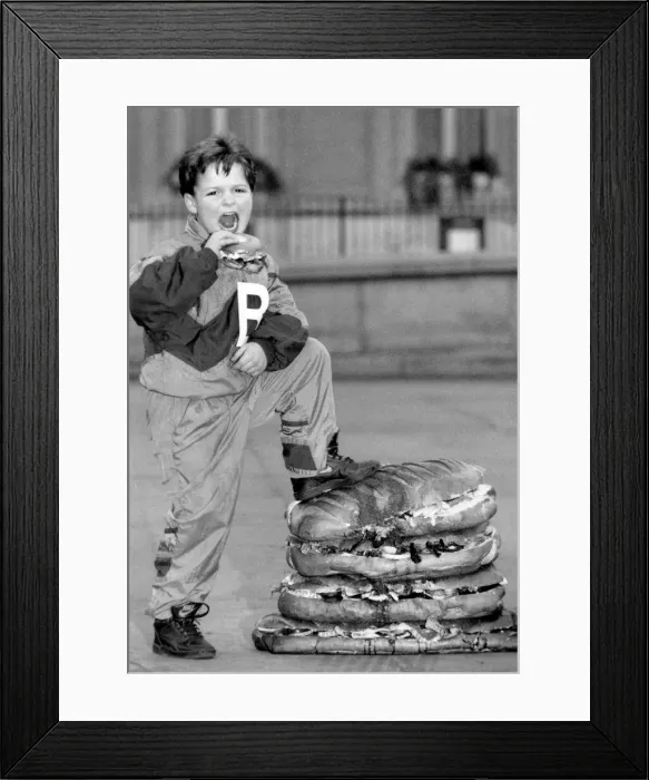 Framed Print : 6 year old Billy Sicklemore enjoying the biggest ever B. L. F sandwich in Trafalgar Square Framed Print : 6 year old Billy Sicklemore enjoying the biggest ever B. L. F sandwich in Trafalgar Square