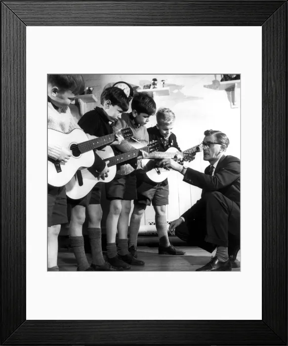 Framed Print : Heamaster Harry Speak of Prestwich Parish C of E Junior School gives guitar lessons to Framed Print : Heamaster Harry Speak of Prestwich Parish C of E Junior School gives guitar lessons to
