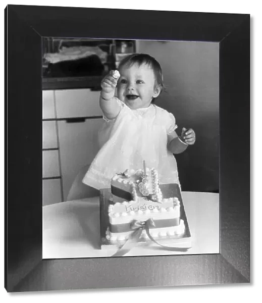 Young Kristen Bullen pictured showing of her cake at her home in Catford