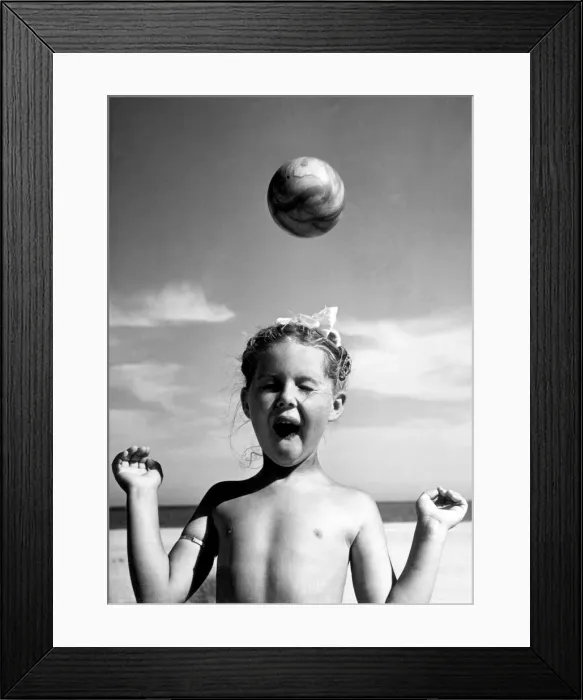 Framed Print : Carol Barwell, aged five, with a beach ball. 2nd August 1950
