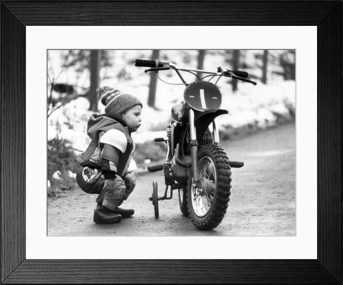 Framed Print : Colin Dick checks over his 50cc Italjet bike. 4th December 1979