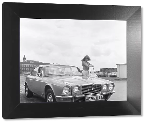 Reveille model seen here posing with a Jaguar XJ12, which is first prize in a Reveille