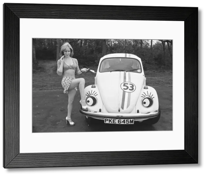 Framed Print : Reveille model Malou Cartwright seen here posing with a Volkswagen Beetle in the guise of Framed Print : Reveille model Malou Cartwright seen here posing with a Volkswagen Beetle in the guise of