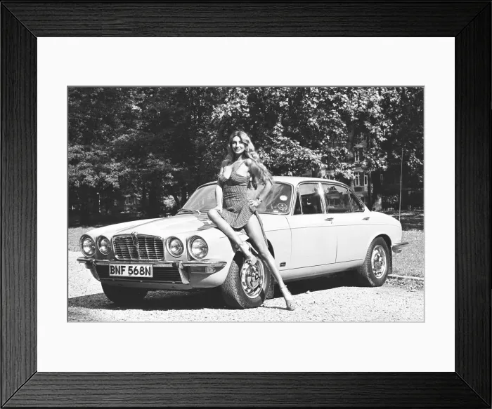 Framed Print : Reveille model Marilyn Coles seen here posing with a Jaguar