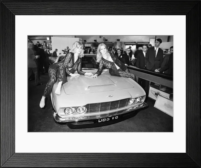 Framed Print : Models drapped over the bonnet of an Aston Martin DBS V8 at the 1969 Motor Show 1st June