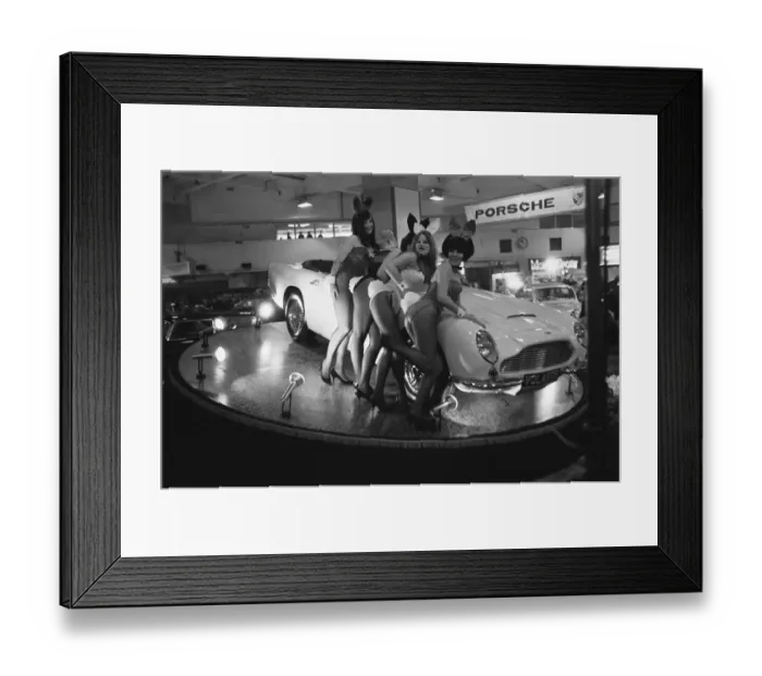 Framed Print : Bunny Girls drapped over an Aston Martin Volante car at the British International Motor