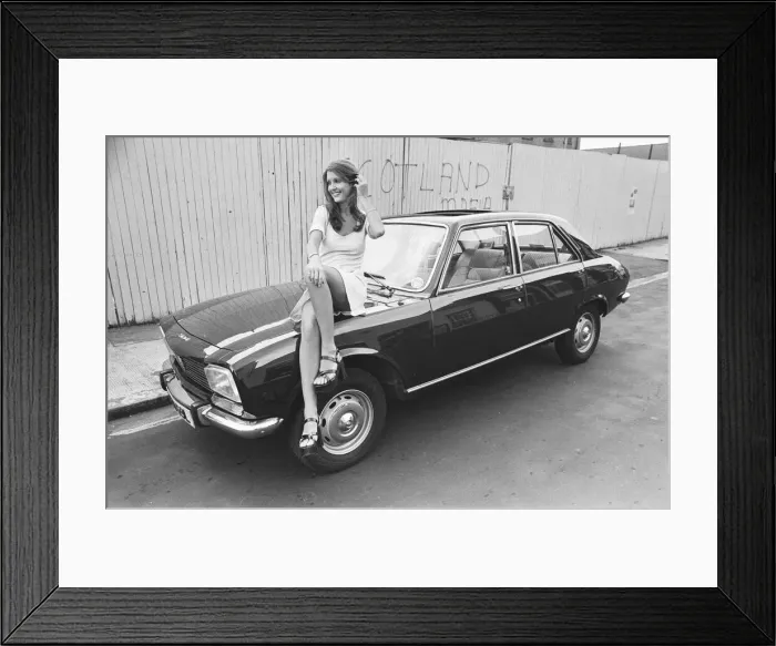 Framed Print : Reveille model Beulah Hughes seen here posing with a Peugeot 504 car which is a top prize