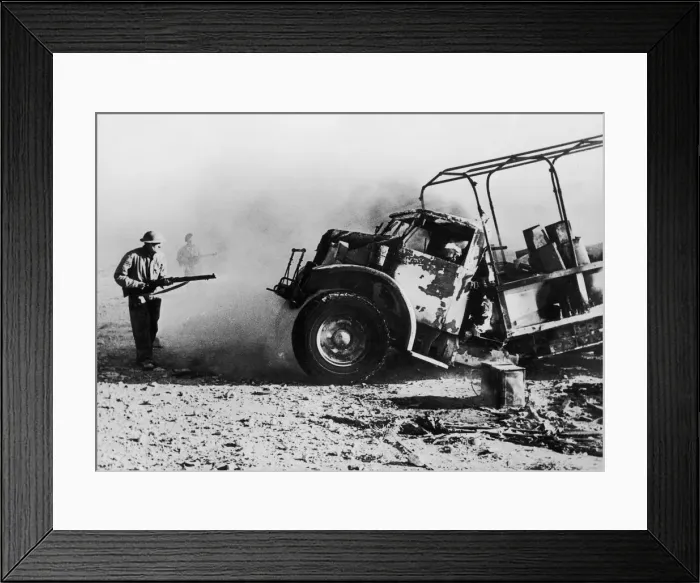 Framed Print : British troops approaching a burning enemy supply truck which along with the supply Framed Print : British troops approaching a burning enemy supply truck which along with the supply