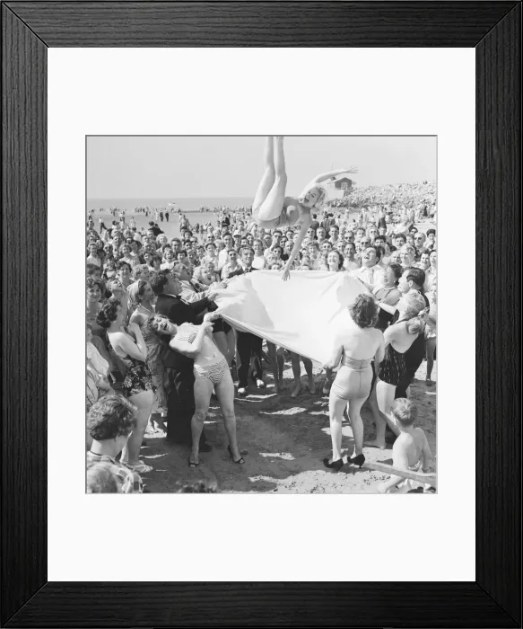 Framed Print : Sunday Pictorial 1957 Beach Party. Angela Manselle seen here being giving the bumps Framed Print : Sunday Pictorial 1957 Beach Party. Angela Manselle seen here being giving the bumps