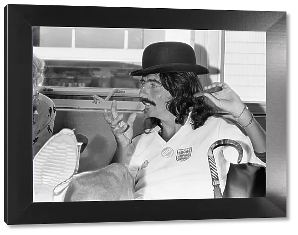 American rock singer Alice Cooper wearing a bowler hat and England football shirt
