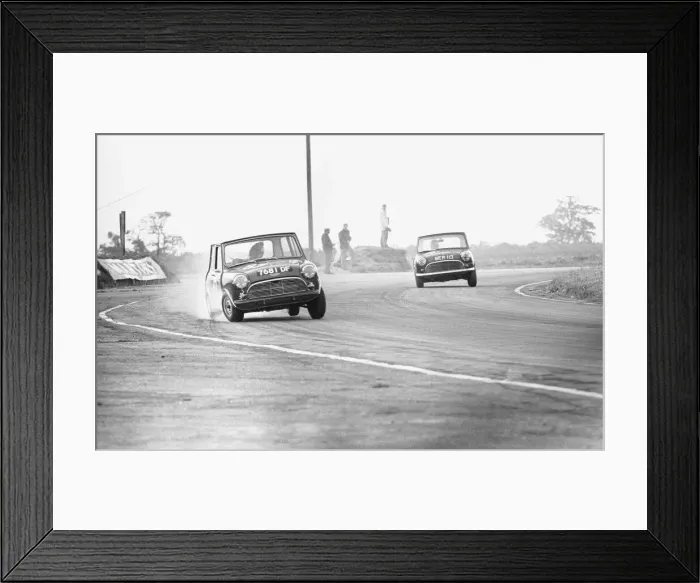Framed Print : Two Mini Coopers seen here competing in the Daily Mirror Trophy event at Snetterton 29th Framed Print : Two Mini Coopers seen here competing in the Daily Mirror Trophy event at Snetterton 29th