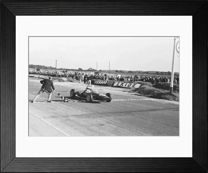Framed Print : Peter Arundell in his Lotus 22 takes the checkered flag to win the Molyslip Trophy / IV Framed Print : Peter Arundell in his Lotus 22 takes the checkered flag to win the Molyslip Trophy / IV