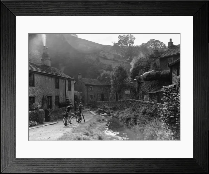 Framed Print : Two boys out on their bicycles near a stream in the Peak District village of Castletown Framed Print : Two boys out on their bicycles near a stream in the Peak District village of Castletown