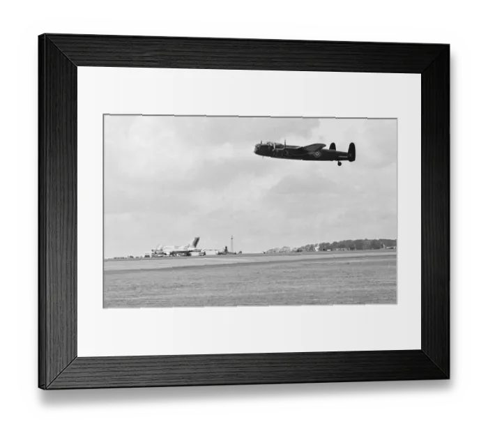 Framed Print : Old and new, a Avro Lancaster over flies a Avro Vulcan V bomber whilst taking part in