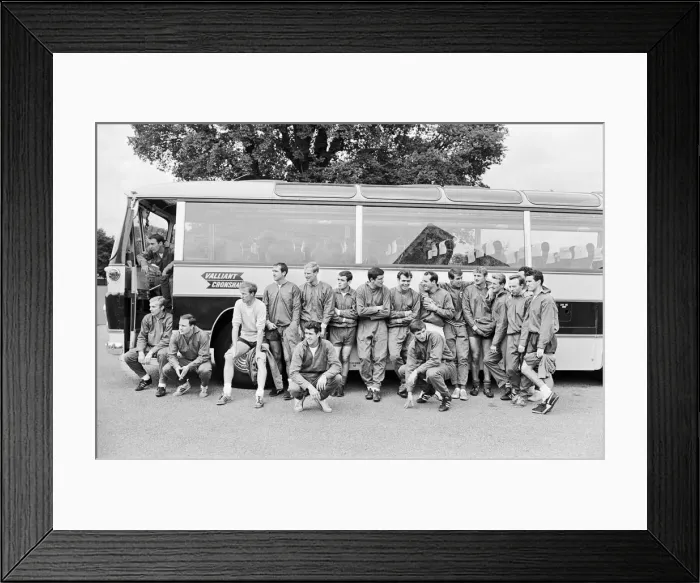 Framed Print : The England squad stand next to their coach as they relax at Hendon Hall Hotel the day Framed Print : The England squad stand next to their coach as they relax at Hendon Hall Hotel the day
