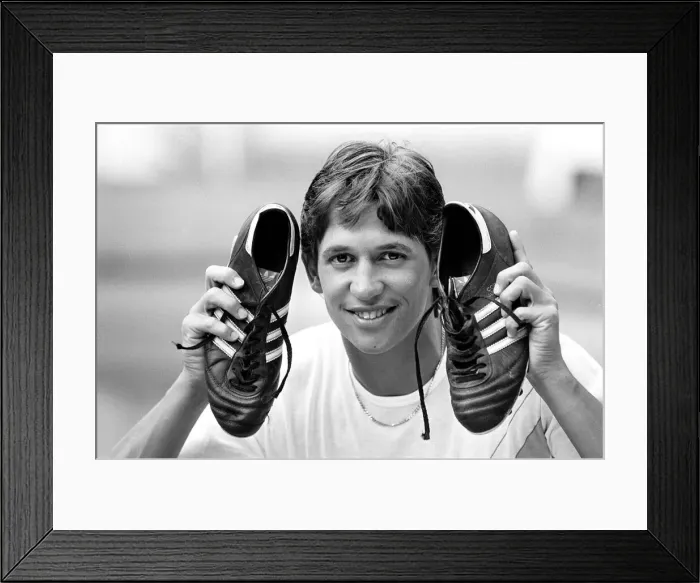 Framed Print : England footballer Gary Lineker shows off his shooting boots at the team base in