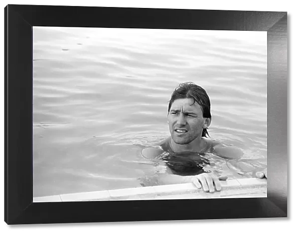England footballer Bryan Robson relaxing in the swimming pool at the Cima Club in