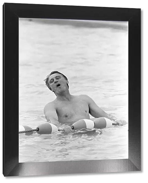 England manager Bobby Robson relaxing in the swimming pool at the Cima Club in Monterrey