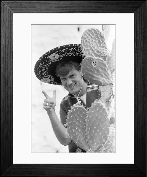 Framed Print : England footballer Glenn Hoddle poses as a Mexican bandit Framed Print : England footballer Glenn Hoddle poses as a Mexican bandit