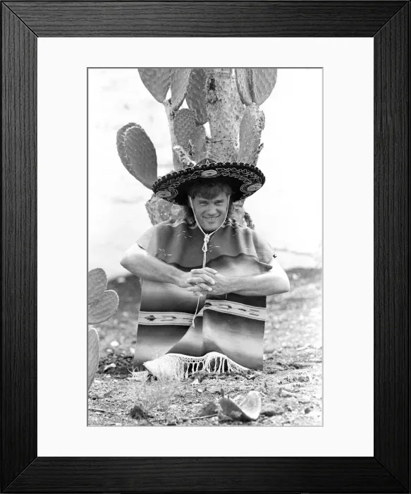 Framed Print : England footballer Glenn Hoddle poses as a Mexican bandit Framed Print : England footballer Glenn Hoddle poses as a Mexican bandit