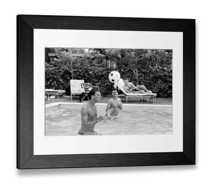 Framed Print : England footballers Alvin Martin (left) and Steve Hodge playing head tennis in
