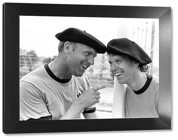 England footballer Tony Woodcock (right) and coach Don Howe in relaxed mood wearing