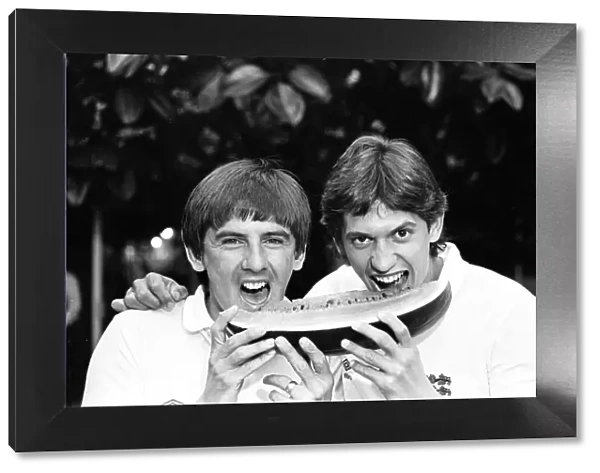 England footballers Gary Lineker (right) and Peter Beardsley sharing a slice of water