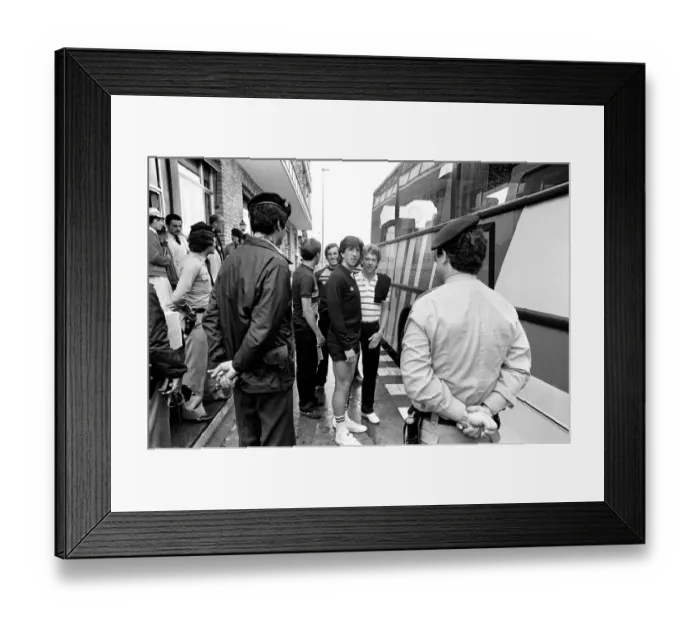 Framed Print : England footballers Paul Mariner and Graham Rix wait to board the bus at the team hotel Framed Print : England footballers Paul Mariner and Graham Rix wait to board the bus at the team hotel