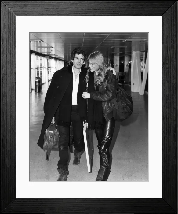 Framed Print : Keith Richards guitarist with the Rolling Stones leaving Heathrow with his girlfriend Framed Print : Keith Richards guitarist with the Rolling Stones leaving Heathrow with his girlfriend