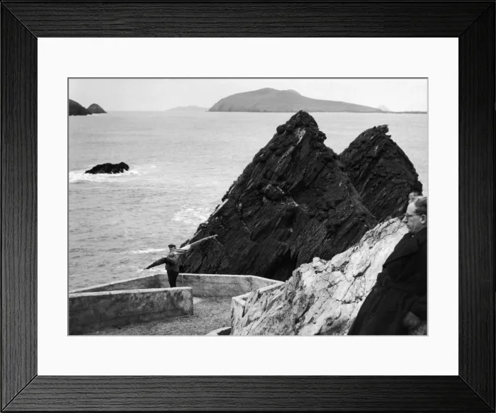 Framed Print : a fisherman makes his way down to the harbour on Ireland Framed Print : a fisherman makes his way down to the harbour on Ireland