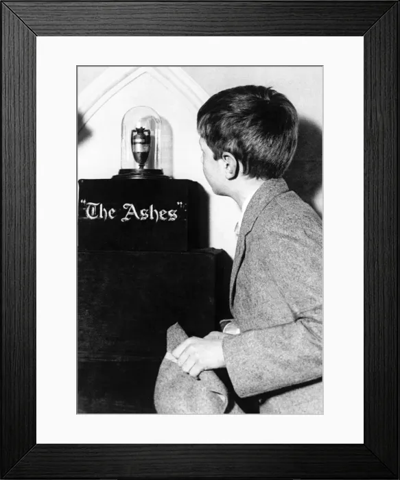 Framed Print : The Ashes Trophy, a young schoolboy looks Framed Print : The Ashes Trophy, a young schoolboy looks