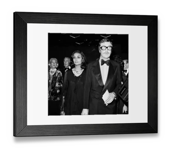 Framed Print : Michael Caine and wife Shakira at the Premiere of Gold 5th September 1974