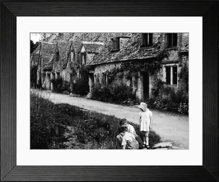 Framed Print : Children playing on the road outside a picturesque row of cottages in Arlington Row in Framed Print : Children playing on the road outside a picturesque row of cottages in Arlington Row in