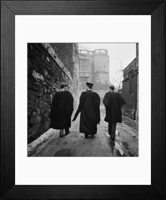 Framed Print : Student of Oxford University walking through one of the narrow back streets of the town Framed Print : Student of Oxford University walking through one of the narrow back streets of the town