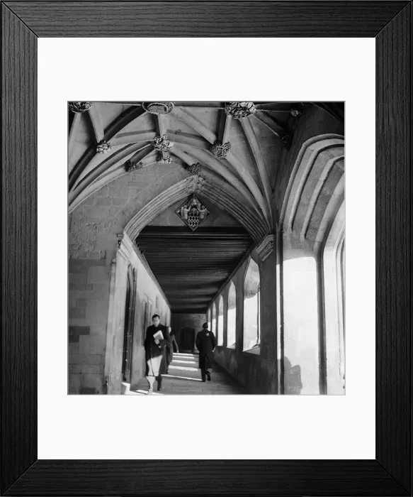Framed Print : Students and professors walk through the corridors of one of the colleges of Oxford Framed Print : Students and professors walk through the corridors of one of the colleges of Oxford