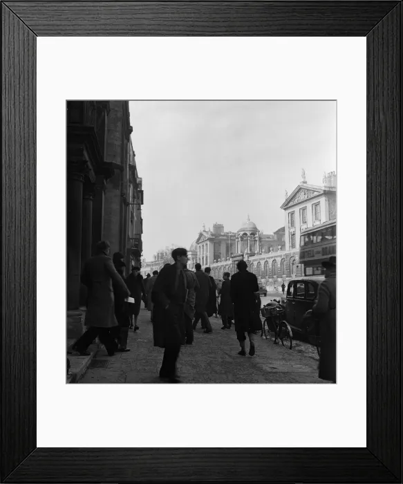 Framed Print : Students of Oxford University beside one of their colleges, out and about in the town