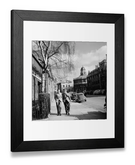 Framed Print : Two students of Oxford University walk near the Sheldonian Theatre at Broad Street Framed Print : Two students of Oxford University walk near the Sheldonian Theatre at Broad Street