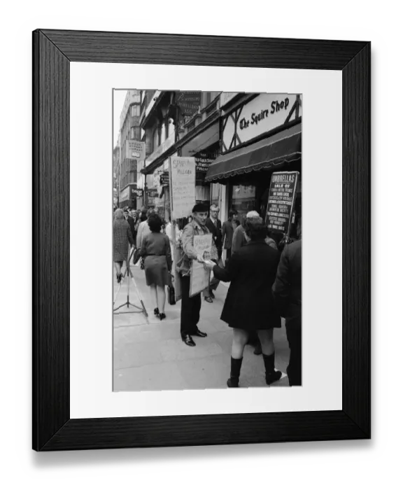 Framed Print : Spike Milligan & wife Paddy use a Sandwich board - borrowed from British Rail Lost