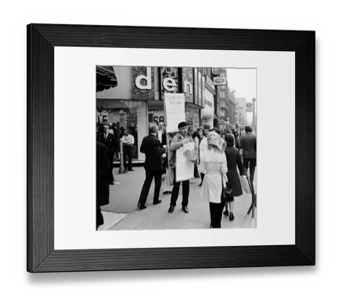 Framed Print : Spike Milligan & wife Paddy use a Sandwich board - borrowed from British Rail Lost