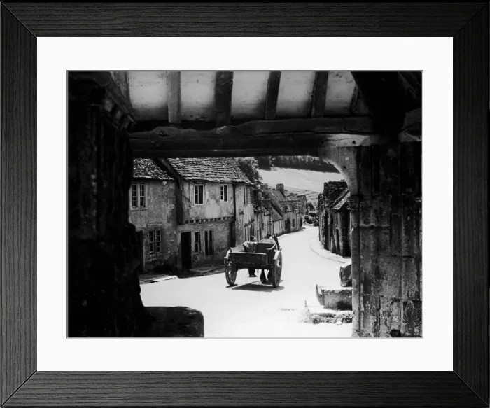 Framed Print : Horse drawn cart makes its way down a typical Cotswold village road in Gloucestershire Framed Print : Horse drawn cart makes its way down a typical Cotswold village road in Gloucestershire