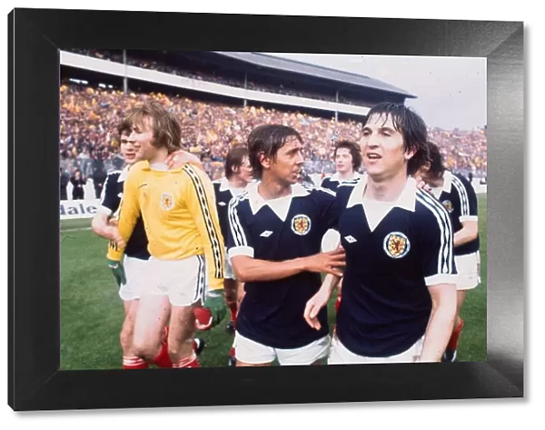 Scotland footballers Tom Forsyth and goalkeeper Alan Rough celebrate victory over England