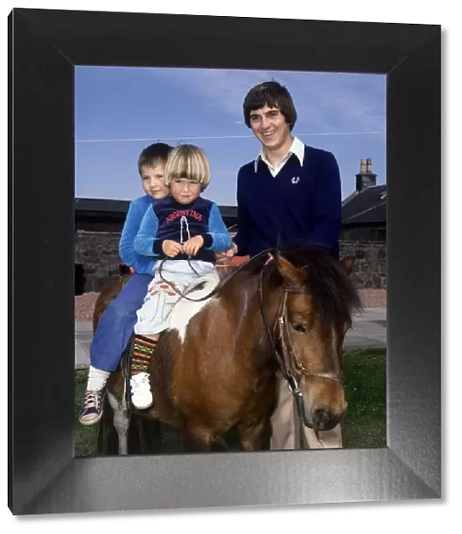 Rangers and Scotland footballer Tom Forsyth on holiday with his daughters, June 1978