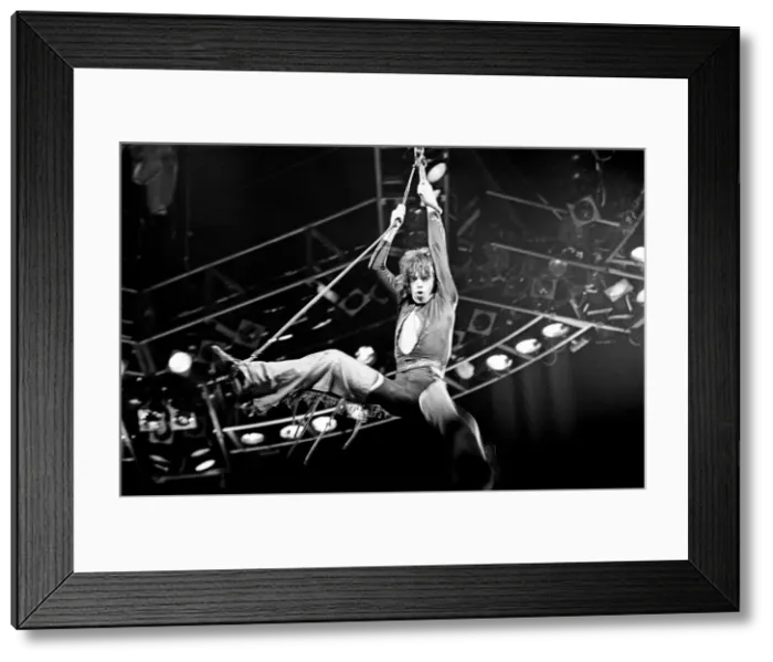 Framed Print : Rolling Stones Concert, Stones singer Mick Jagger swings high in the air during a concert Framed Print : Rolling Stones Concert, Stones singer Mick Jagger swings high in the air during a concert