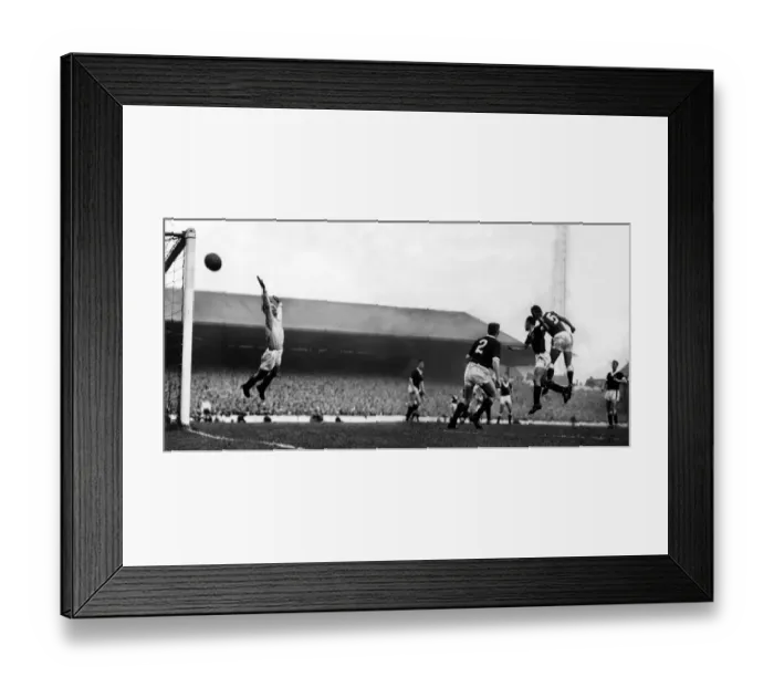 Framed Print : Wales v Scotland at Ninian Park, Cardiff. Welsh centre-half John Charles outjumps Framed Print : Wales v Scotland at Ninian Park, Cardiff. Welsh centre-half John Charles outjumps