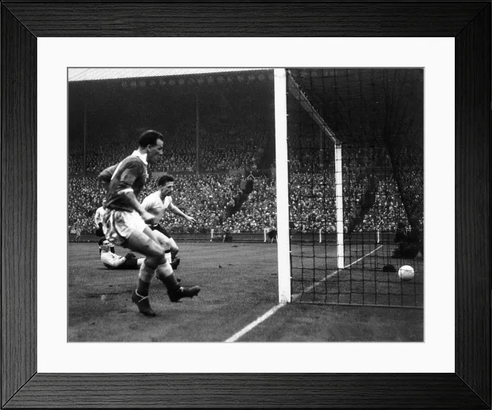 Framed Print : John Charles of Wales left scores against England in the international match between