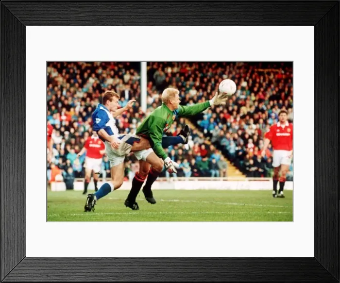 : Peter Schmeichel Manchester United goalkeeper in a tangle with Alan Shearer of Blackburn : Peter Schmeichel Manchester United goalkeeper in a tangle with Alan Shearer of Blackburn
