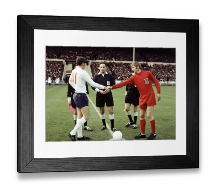 Framed Print : International Football England v Wales. Martin Peters and Alan Durban shake hands before Framed Print : International Football England v Wales. Martin Peters and Alan Durban shake hands before