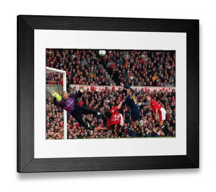 Framed Print : Manchester Uniteds goalkeeper Peter Schmeichel dives to save Wimbledons Dean Blackwell Framed Print : Manchester Uniteds goalkeeper Peter Schmeichel dives to save Wimbledons Dean Blackwell